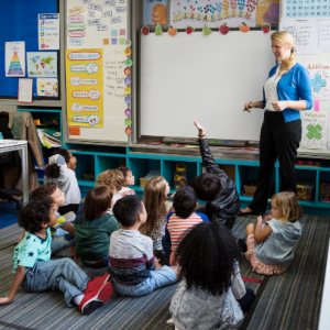 kindergarten-students-sitting-on-the-floor-listeni-PGSAUTP-1.jpg